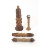 Four late 19th Century Tyrolean carved wood needle cases, comprising a standing cylinder form