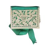 An attractive 19th Century carved and pierced ivory needle book, with green silk backing, spine