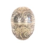 An 18th Century silver nutmeg grater, unmarked, the egg form case with flowerheads, scrolls, and