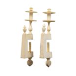 A pair of early 19th Century ivory sewing clamps, the slightly tapering rectangular frames each with