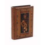 A Tunbridge ware ‘secret’ book, in cedar, the ‘spine’ fitted with three drawers, the cover with a