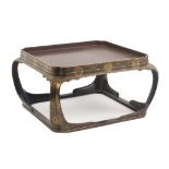 A late 19th Century Japanese lacquer stand, of square form on curved supports, 38cms. sq. max.,