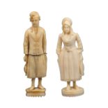 A matched pair of 19th Century Dieppe ivory figural standing needle cases, comprising a fisherman in