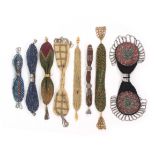 Eight small format 19th Century misers purses, mostly decorated with metal beads, largest
