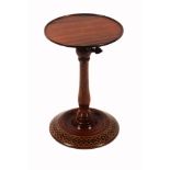 A Tunbridge ware turned rosewood adjustable candle stand, the circular top on baluster column with