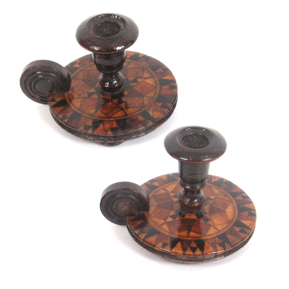 Two similar miniature Tunbridge ware candle holders, of chamber stick form each on three turned feet