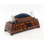 A Tunbridge ware dressing table stand, of tapering rectangular form raised on bun feet, the sides