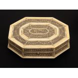 A late 18th Century Russian pierced and carved bone gaming counter box of octagonal form, the lid