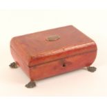 A Regency red leather covered sewing box of small rectangular form, raised on gilt paw feet,