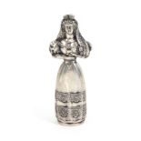 A continental silver standing figural needle case, in the form of a woman in elaborate headdress her