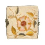 An attractive 19th Century needle book in white damask, the cover embroidered in coloured silks with