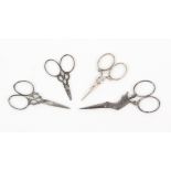 Four pairs of 19th Century steel scissors, comprising a lace makers pair, 6.5cms, a pair in the form