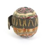 An 18th Century miniature knitted silk pin ball, in multiple colours with spiders web design,
