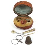 A miniature etui for a doll or child contained in a natural walnut and commemorating the crowning of