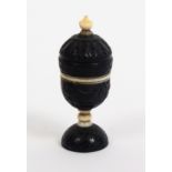 A fine early 19th Century carved coconut and bone thimble case of urn form, with ivory thimble,