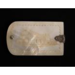 A fine mother of pearl swivel notelet the cover engraved with a view of Crystal Palace, the