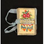 An attractive bone needle book/pin cushion, ‘A Present From Gloucester’, one side painted with