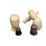 Two 19th Century ivory thimble cases, comprising an acorn form example with internal reel and