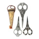 Three pairs of 19th Century Italian steel scissors, comprising a pair with fruiting vine arms and