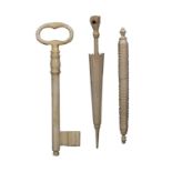 Three 19th Century bone needle cases, comprising an example in the form of a key, 11.5cms, another