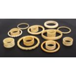 Napkin rings, early 20th Century comprising a set of six ivory Chinese examples in original box,