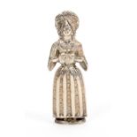 A continental silver figural standing needle case, in the form of a woman with elaborate headdress