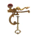 An elaborate mid 19th Century gilded brass sewing clamp, the ‘C’ form frame as a cornucopia