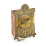 A rare metal novelty tape measure in copper and brass as a mantel clock, the printed tape in ins.