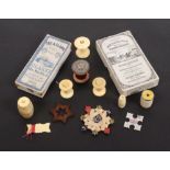Reels, winders and related packaging, comprising a pair of bone reels with fancy tops and labels