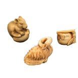 Three early 20th Century ivory netsuke, comprising a rat, 4.5cm, a swan, 5cm, and a fruit one leaf