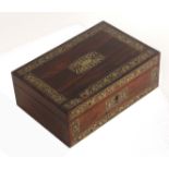 A mid Victorian rosewood rectangular sewing box with well fitted interior, the lid and front with