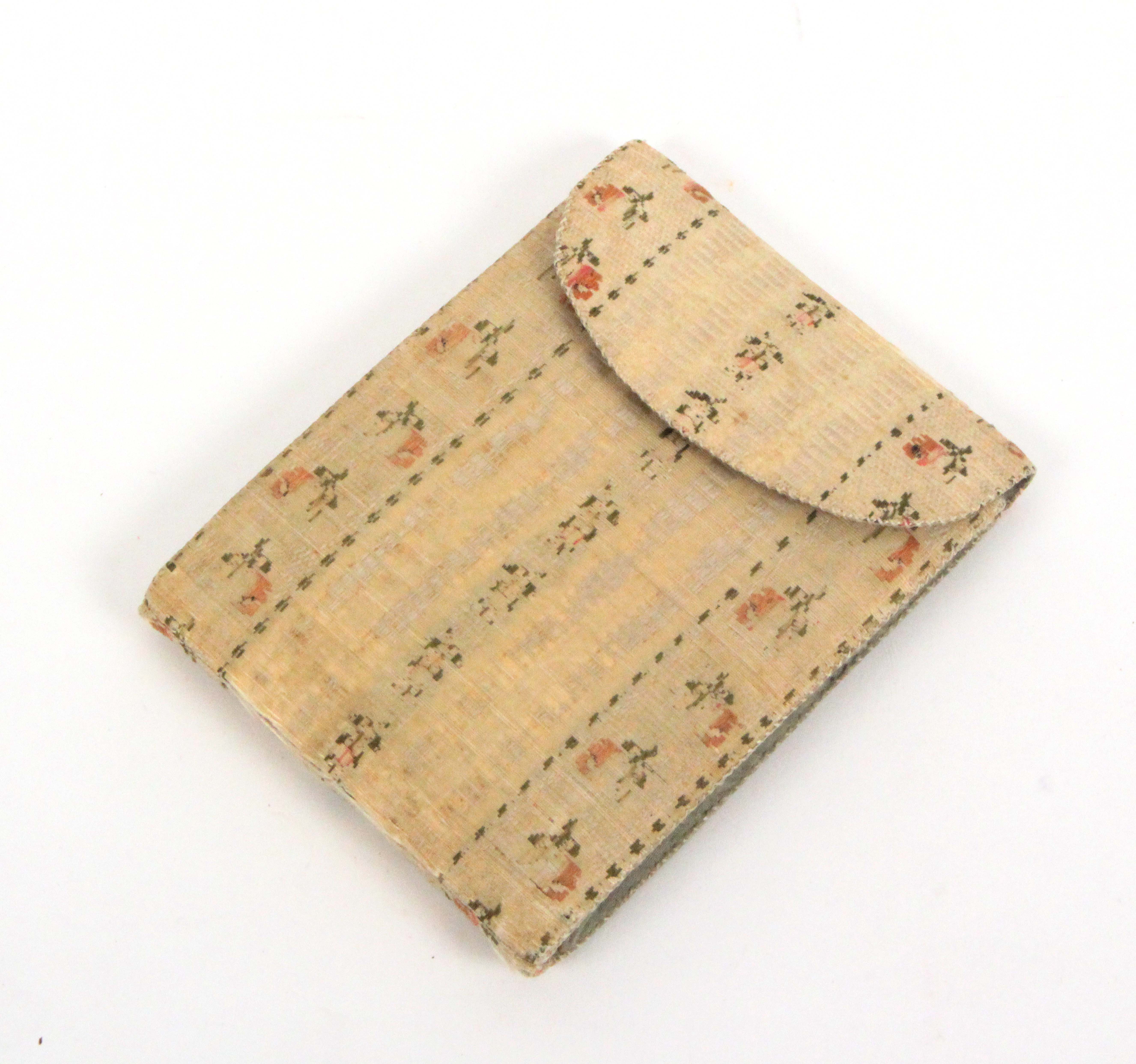 An 18th Century home made sewing companion in floral decorated silk of rectangular form, the