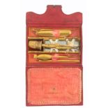 A good early 19th Century leather cased etui with a full complement of fittings, the tooled red