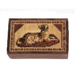 A Tunbridge ware mosaic block depicting a dog at rest within a geometric border, 7 x 4.2cm.