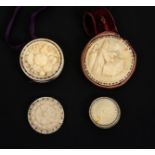 Five 19th Century bone and ivory disc form pin cushions, one carved to one side with a figure at a