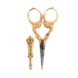 A fine pair of 19th Century gold mounted scissors with sheath, the steel oval section blades to gold