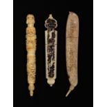 Three 19th Century bone needle cases, comprising a tapering cylinder example with male head finial