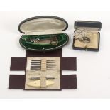 Three small cased sewing sets, comprising a green leatherette example with white metal tatting