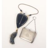 Two silver purses and a celluloid lady’s make up compendium, the silver purse of rectangular form