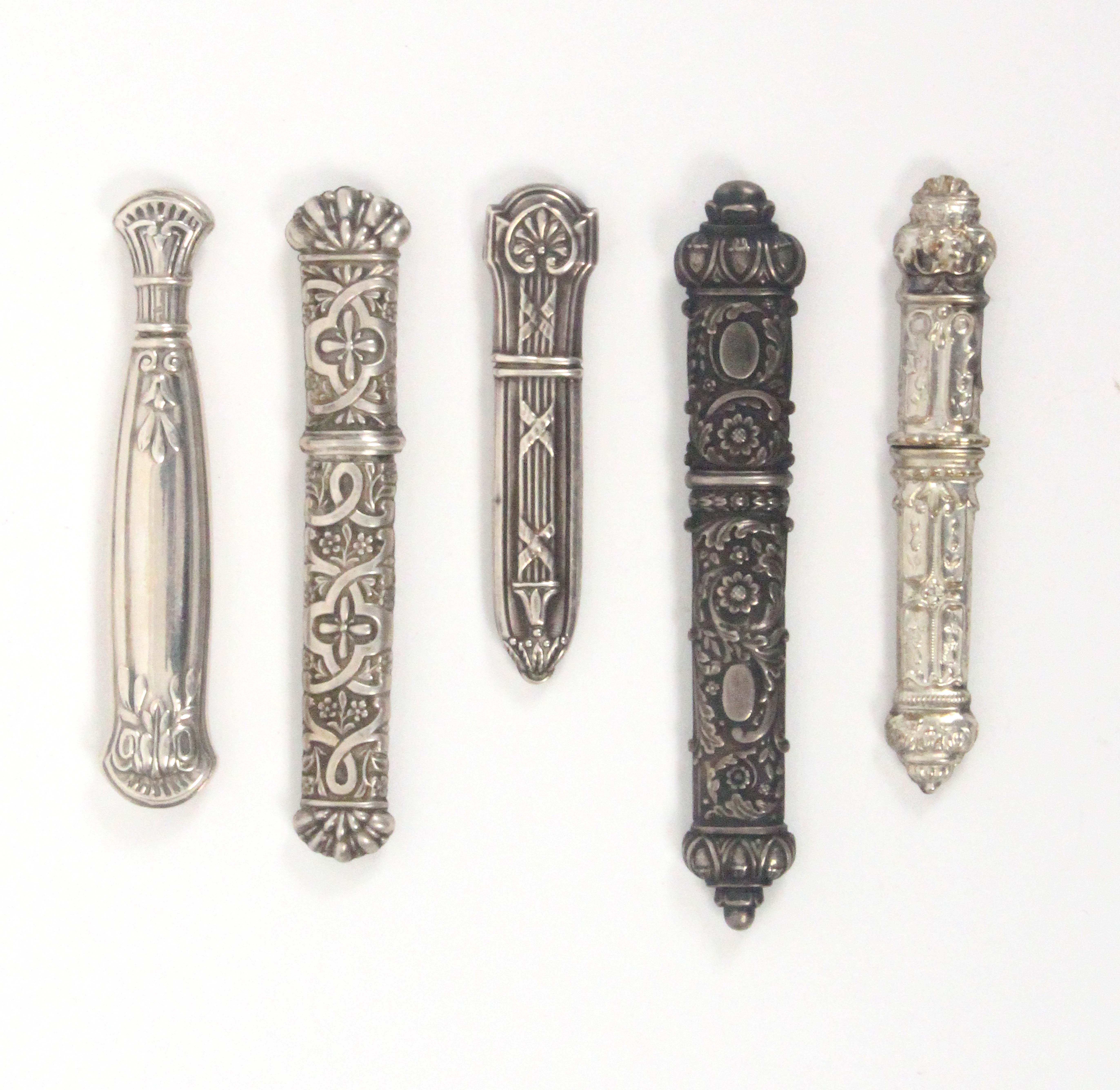 Five 19th Century and early 20th Century continental silver needle cases, all with decorative