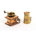 Two novelty metal tape measures, comprising a brass example in the form of a milk churn, the