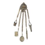 A late 19th Century plated brass chatelaine, the pierced oval clip mount with three owls on a branch