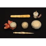 Six 19th Century ivory Madras sewing tools, with burnt circle decoration comprising a cylinder