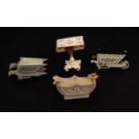 Four 19th Century bone or ivory pierced board pin cushions, comprising a pedestal table, a vase and