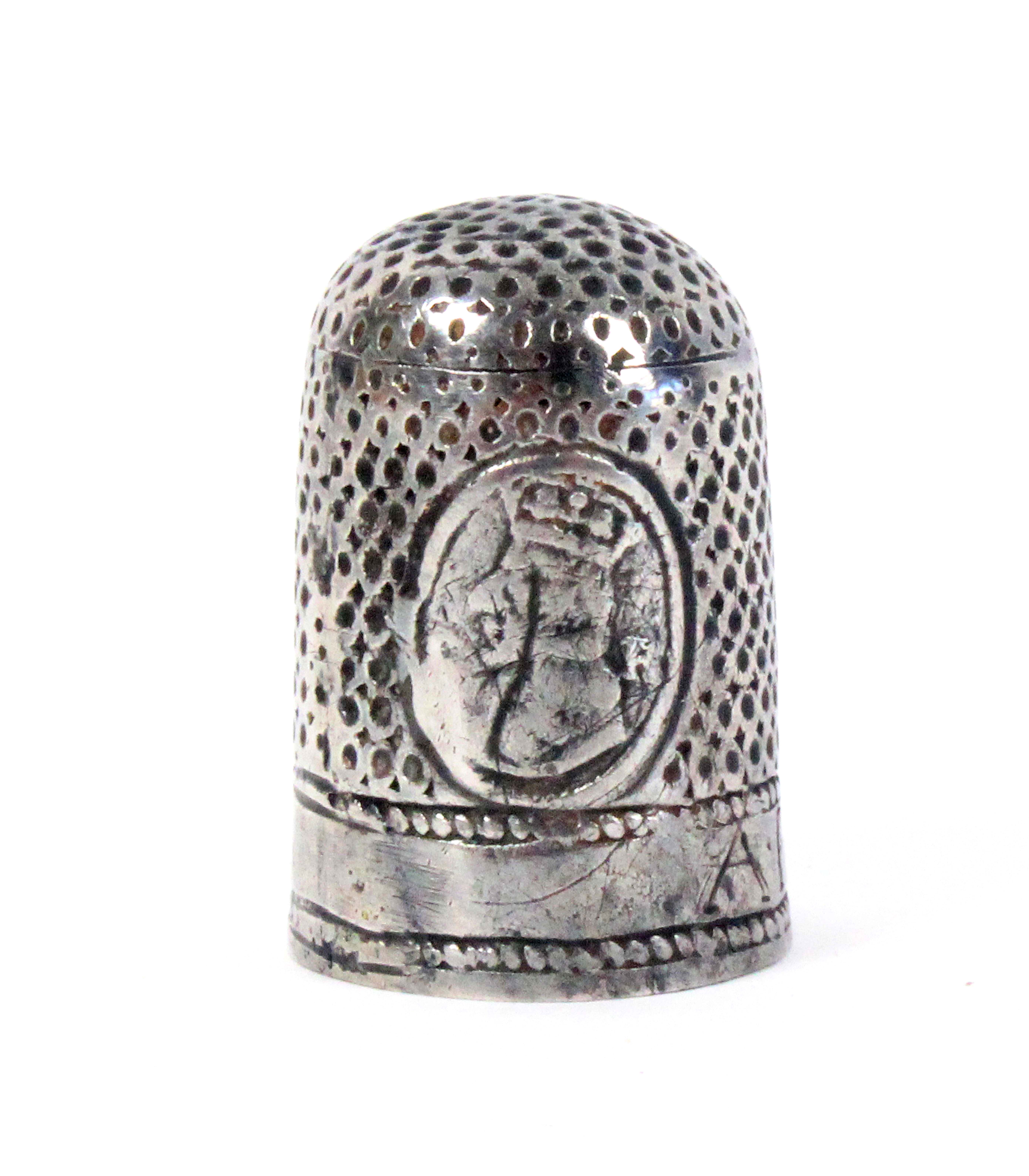 A rare Charles II commemorative silver thimble, with two oval panels, one depicting a wedding bust
