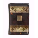 A mid 19th Century tortoiseshell and gold inlaid card purse/notelet, the cover with two bands of