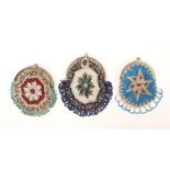 Three 19th Century bead work circular form purses, all with a central geometric motif, two with