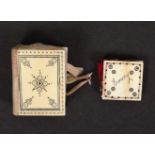 Two early 19th Century ivory sewing accessories, with burnt circle decoration comprising a book form