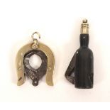 Two late 19th Century novelty cigar cutters, comprising a horseshoe form example stamped Patent ‘M+