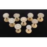 Nine various mother of pearl top reel holders, one with loss to edge, largest 3.5cm high.     (9)